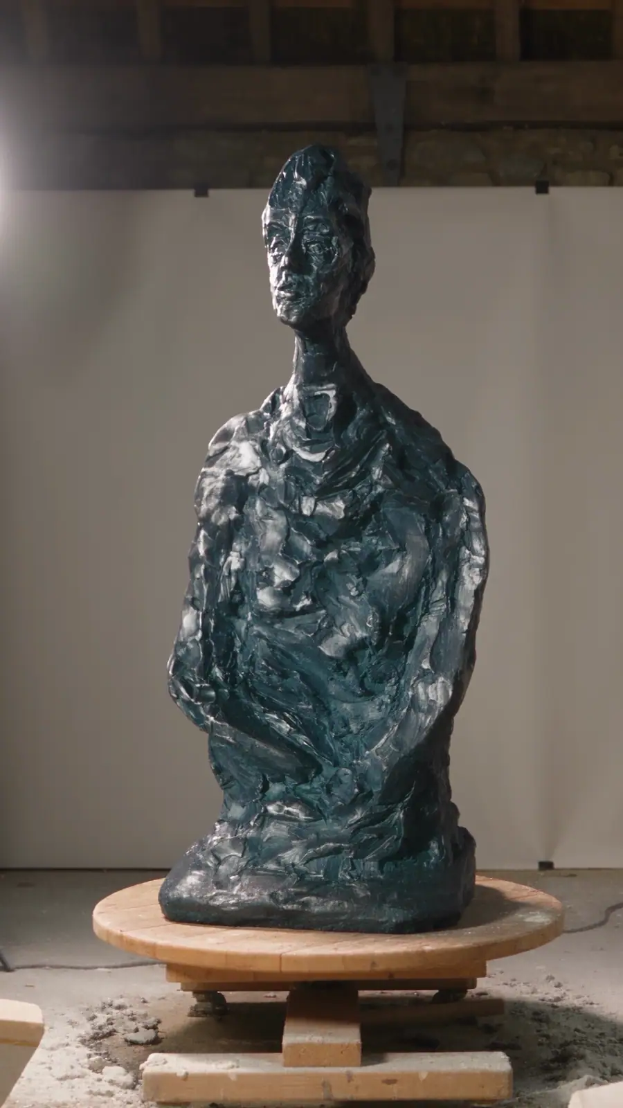 The finished cast with a blue patina
